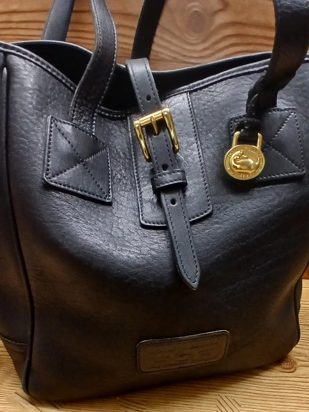 Dooney & Bourke Black Leather Tote with Gold Charm